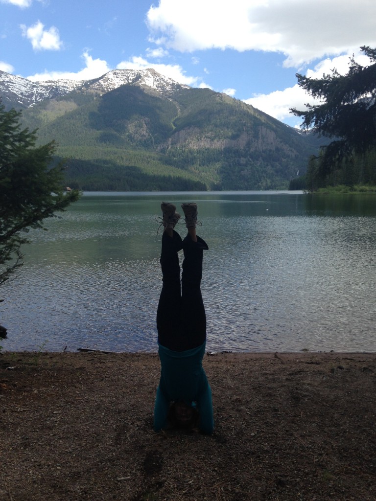 Kristin practicing yoga on the shore of Holland Lake.