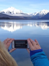 Capturing the view of Glacier's snow-covered peaks from Lake McDonald. 