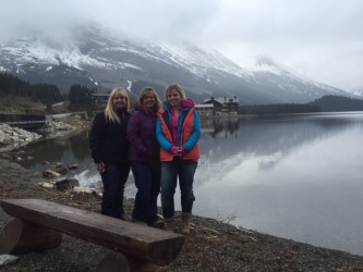 Standing on the shore of Swiftcurrent Lake in Many Glacier. 