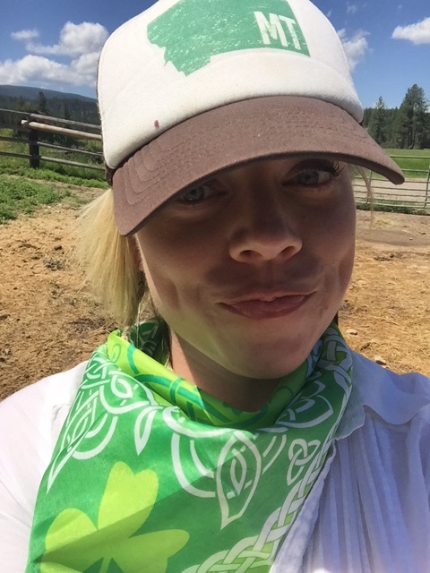 My Montana cowgirl attire includes a baseball hat and an Irish bandanna from Butte. 