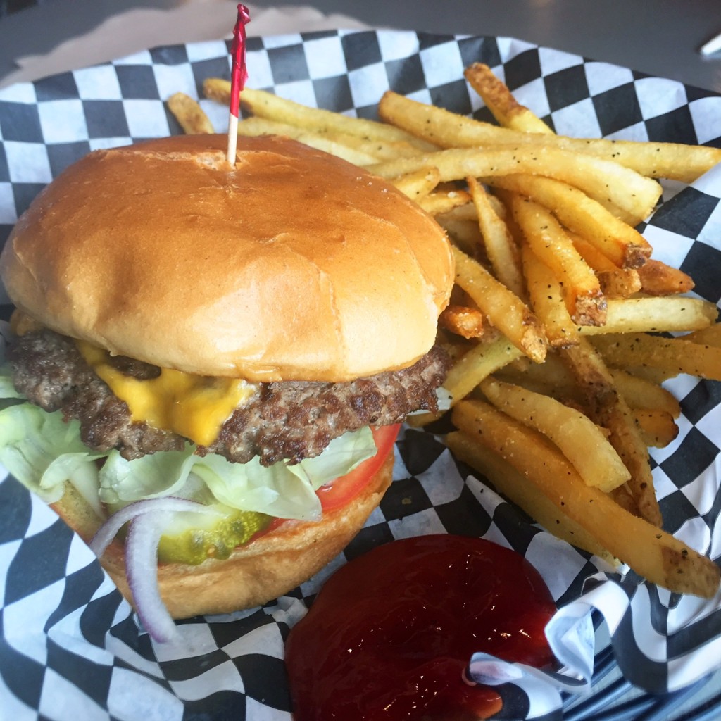 My order: a regular cheeseburger, fully loaded, with a small order of greek garlic fries. YUM. 