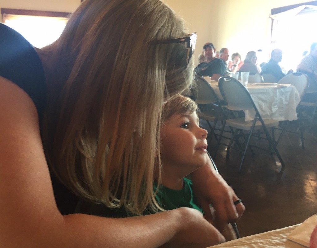 Katie and Milo listening to the song at the end of the meal. 