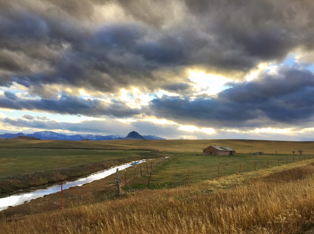 Wide-open spaces, an old barn and Haystack Butte. 